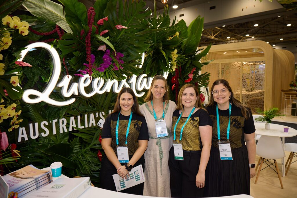 Group of 4 TEQ Staff pictured at the Queensland booth at ATE