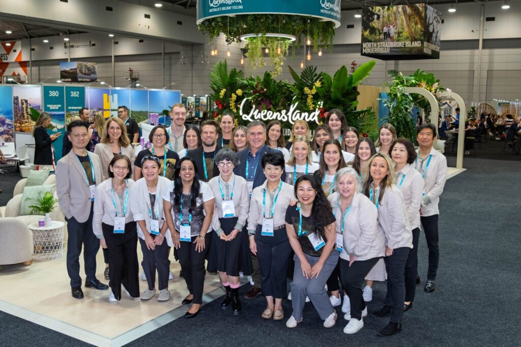 TEQ Group Staff Photo in front of Queensland booth at ATE