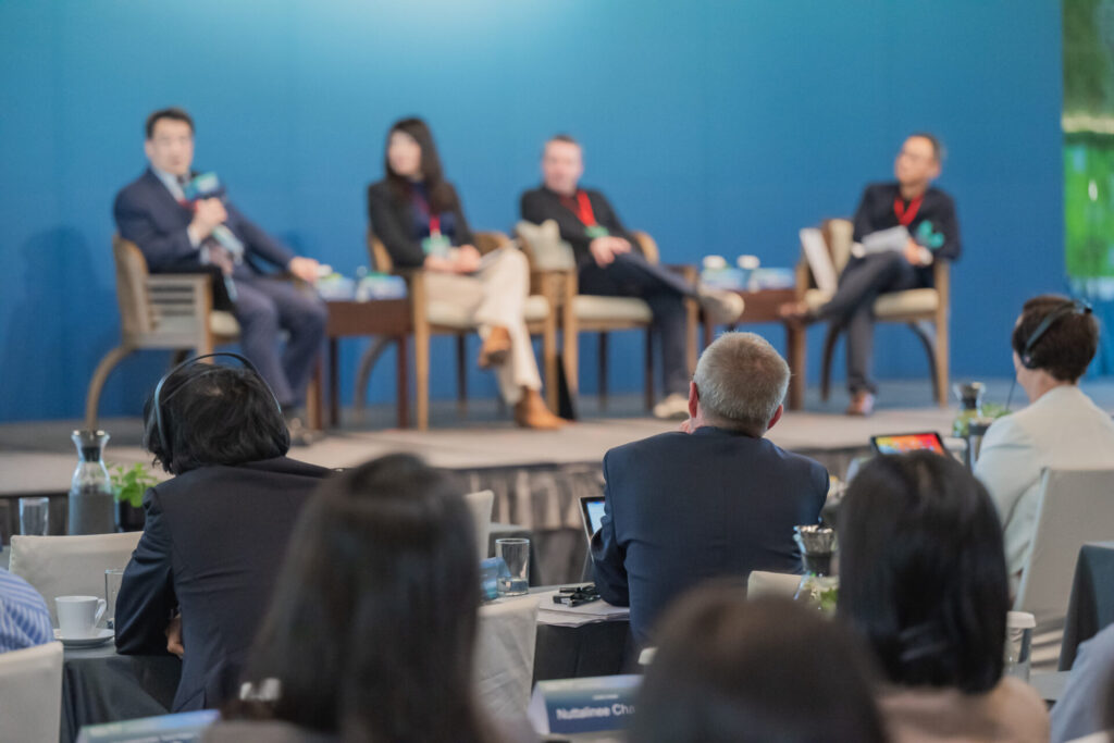 A panel of speakers on stage at the Inner Circle Forum