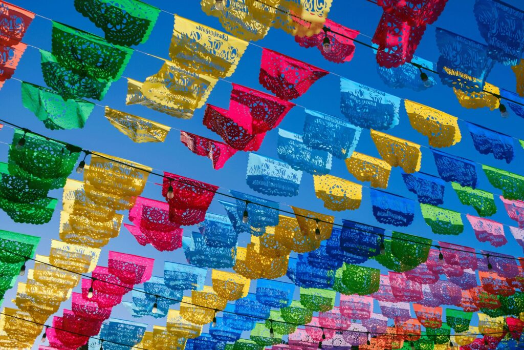Papel picado close up against blue sky