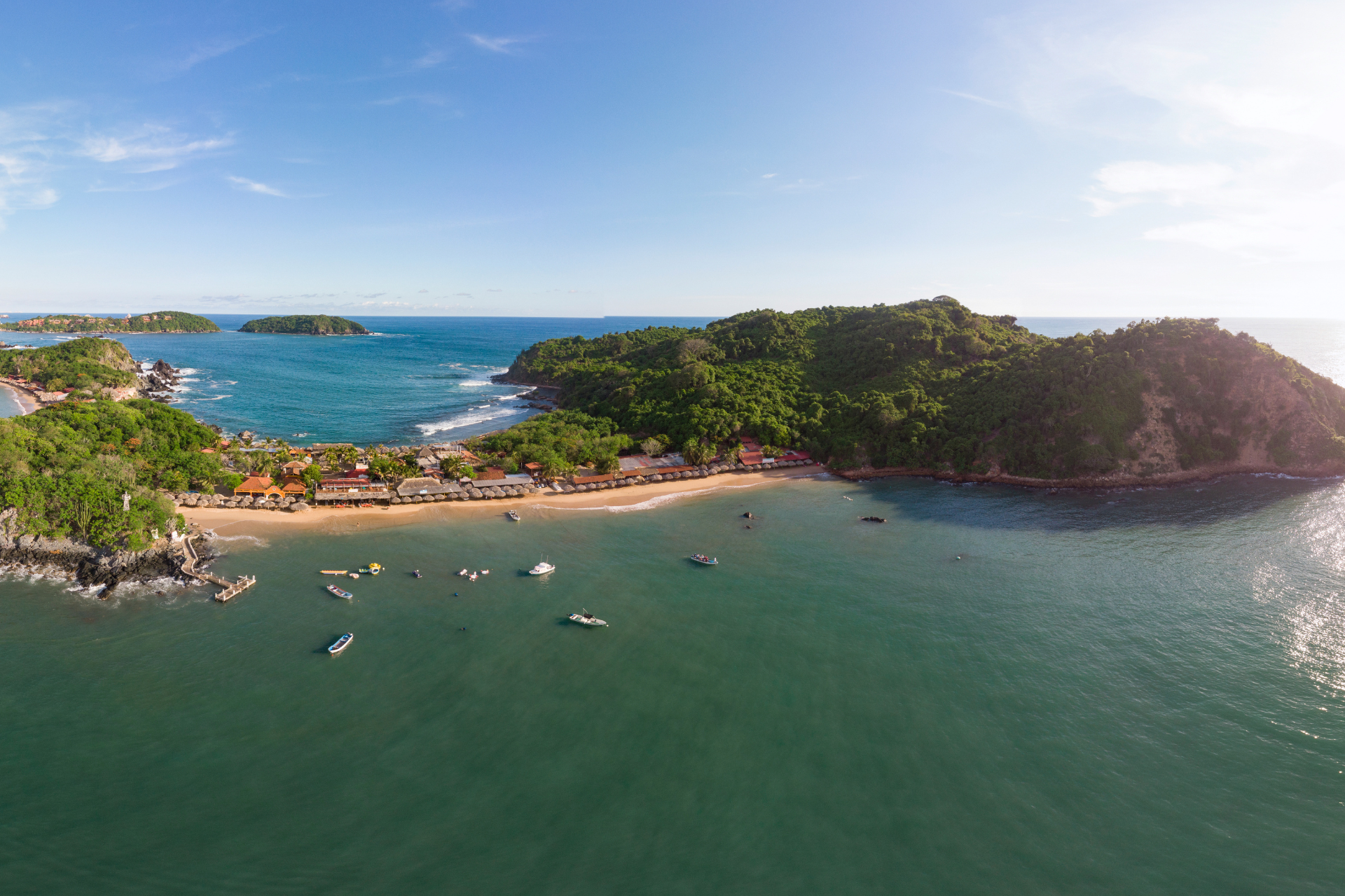 Aerial view of water, boats and an island