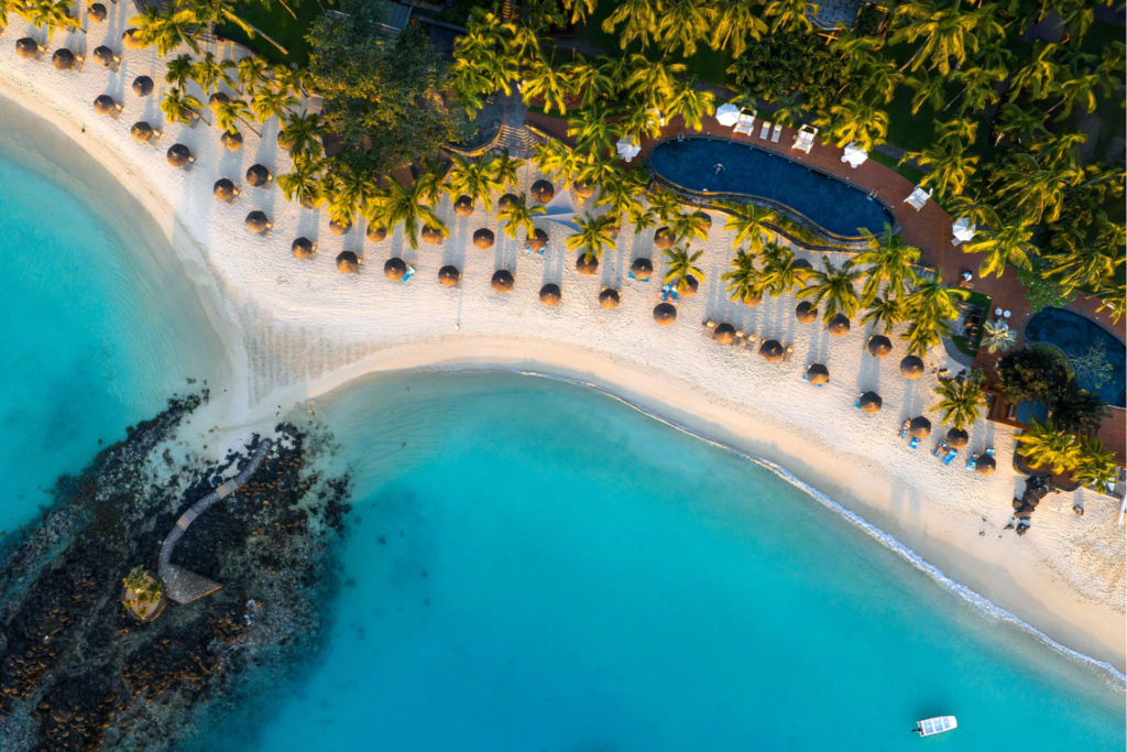 Above aerial view of waterfront Royal Palm Beachcomber Luxury Resort